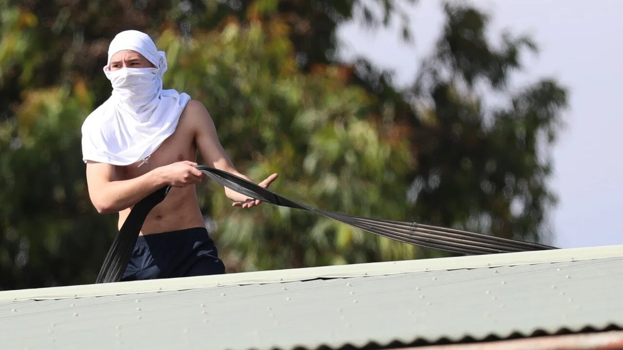  A boy on the roof at Parkville youth detention centre during a riot in November, 2017. Photo: Herald Sun 